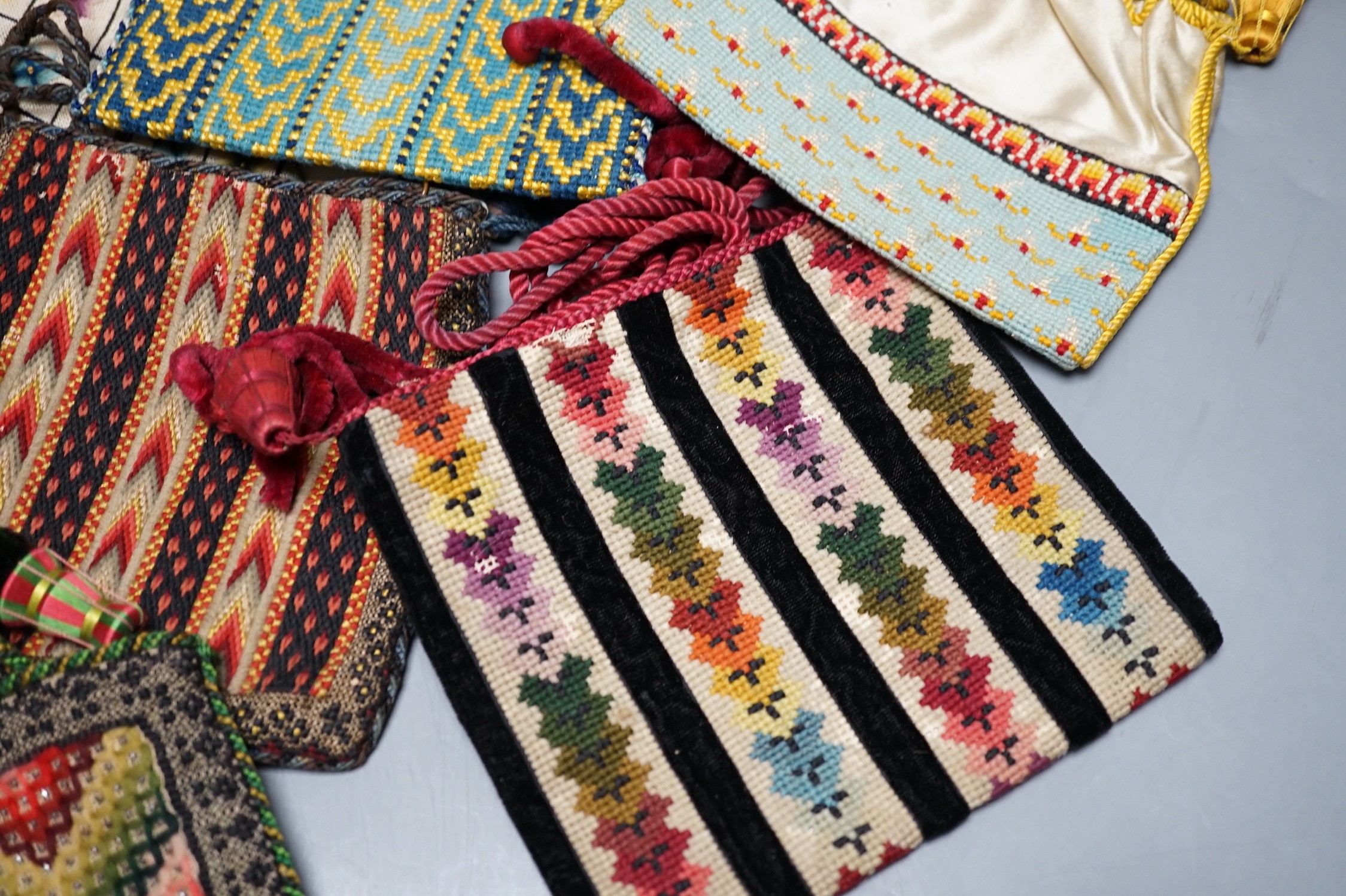 Ten 19th century embroidered and woolworked bible bags, largest 18 x 16cm